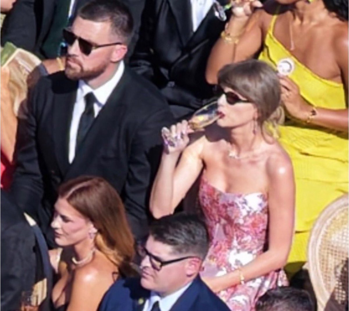 SwiftNYC's tweet photo. I’m obsessed with her dress! 

Taylor Swift and Travis Kelce recently at JuJu Smith-Schuster and Laura Kruk’s wedding! 🤍 https://t.co/8mr8Khguzm