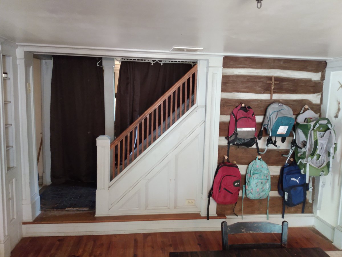 AHomelyHouse's tweet photo. Managing a big household is challenging, no matter what your circumstances are. We have 10 kids living in a 3 bedroom farmhouse cabin from the 1700's. My wife tried a number of approaches over the years with mixed results, and at one point asked me to devise a system for it.  

I opted for a household SOP (standard operating procedure) system based on the kinds of systems we used in the military - there are always lots of people and gear to manage and keep in good order there, usually under less-than-ideal circumstances. We used SOPs a lot - you figure out an effective fix for the problem, codify it, then train all the junior personnel on it. That becomes the way you do things. It's always open for modification if necessary, but it gives you a good baseline that takes a lot of guesswork and the need for micromanagement out of the equation. Once everyone knows how the system works, it can fairly well run itself. Your job as the leader is just to check periodically, retrain if necessary, and enforce the standards.  

For household chores I went through each room one at a time and cleaned and organized it to my standard. I noted down the inspectable areas and tasks for each room, and took photographs. I wrote up a procedure for each room, annotated the photos, and compiled them all into an SOP binder that lives on the family documents shelf. Each older kid is assigned a room, and their first task in the morning before breakfast and school is to set their room in order to the baseline standard. I do a quick check, then we get breakfast and start our day. It usually takes about 5-10 minutes, and it ensures that we are at least starting the day every day with a clean and orderly house. With a bunch of little kids, the order always gets trashed in the course of a day with all the playing and activities. That is absolutely unavoidable, and shouldn't even be something you put any energy into trying to prevent or resist. It is what is. But we can still keep things in reasonable limits and start our day everyday with some neatness and peace of mind - chronically chaotic houses actually contribute to stress levels in parents and children alike.   

The procedure for a room like this is written out on the SOP page for that room: 
Inspectable Standards: 
· No loose items on the floor or table 
· Bags and hang-up items on pegs 
· Books standing (not stacked) on shelves, shelves straight and tidy  

Daily Tasks: 
A. Clear and wipe table. 
B. Ensure no gear adrift on floor or shelves. 
C. Straighten the books on the shelf. 
D. Sweep the floor.  

Weekly Tasks (every Saturday AM, additional to daily tasks): 
A. High dust, dust horizontals 
B.  Shake and vacuum rug  
C. Mop or scrub floor

Monthly Tasks (1st Saturday of the month): 
A. Wash windows with window cleaner 
B. Low dust, including table base C.   

Once each kid is trained on the tasks and familiar with the standards for their room, it can actually happen surprisingly quickly and easily, and becomes part of their habitual morning routine within a few days. We initially did a rotation of rooms on a schedule, but several of the kids found that they preferred just sticking to one room consistently, so that's how we do it now.   

That's how we do it and keep our small house from getting too chaotic with all the people. I highly recommend making an SOP book where you can write everything out and clearly present things like tasks, conditions, and standards. It makes everyone's lives easier. Hopefully that's helpful for you!