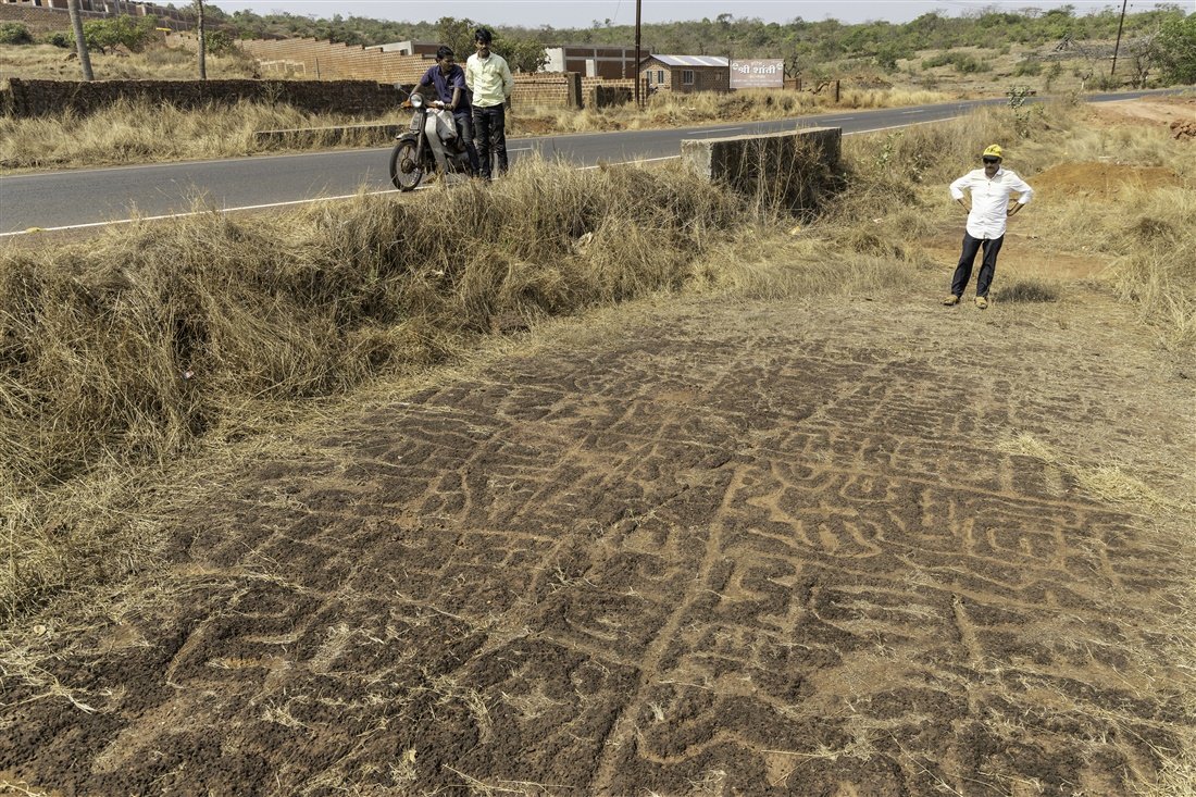 GemsOfINDOLOGY's tweet photo. 1990. Road widening work uncovers petroglyphs at Nivli Fata, Ratnagiri.

Officials from the Directorate of Archaeology AND Archaeological Survey of India are immediately notified.

This becomes the first reported petroglyph site in Konkan.

Scholars rush in. Books are published. Comparisons drawn to Harappan civilization. An entire academic field of Konkan petroglyph studies is born from this one discovery.

The site itself?

Still half-buried under road construction. 36 years later.

Not neglected by accident.
Not lost to time.
Not awaiting discovery.

Reported to two official bodies in 1990.
Documented in RTI responses.
Still under asphalt.

We widened the road. ✅
We triggered an academic renaissance. ✅
We preserved the site that started it all. ❌

The first petroglyph that launched a thousand studies remains buried under the road we chose to finish.

Who decided tarmac matters more than the stone that rewrote Konkan's prehistory? 🛣️🪨