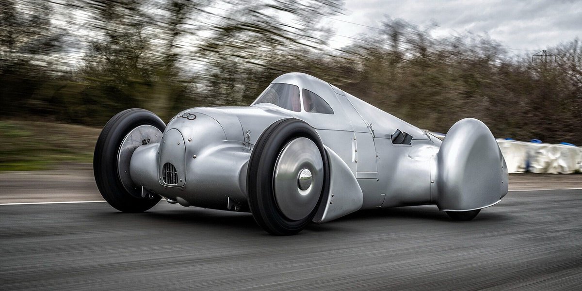 designboom's tweet photo. 90 years later, the silver arrow races again.

@Audi revives the legendary 1935 auto union type c streamliner, recreating one of motorsport's most iconic record breaking cars from the original archives.

https://t.co/o72cKcNWYz

#automotive #design #audi https://t.co/2dqRVm7gZG