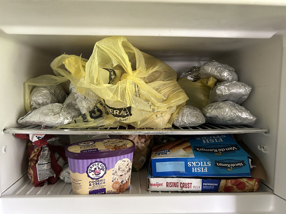 SunshineSight's tweet photo. After a week most of the contents of the top half of the freezer are returning home. Those are my aluminum foil wrapped ground chuck reserves for every-week summer tacos.

The power was out from July 3 to July 5, for the uninitiated. https://t.co/Gp4WjLupwL