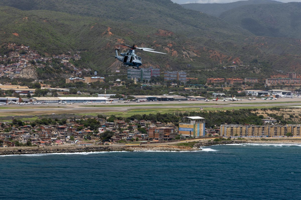 USMC's tweet photo. #Marines with the 24th Marine Expeditionary Unit take part in an aerial damage assessment flight over the coast of Caracas, Venezuela.

At the direction of @Southcom, assigned U.S. military forces are supporting @StateDept-led U.S. disaster assistance to the people of Venezuela in the aftermath of the June 24, 2026, earthquakes.

#MarineCorps #USMC #SemperFi