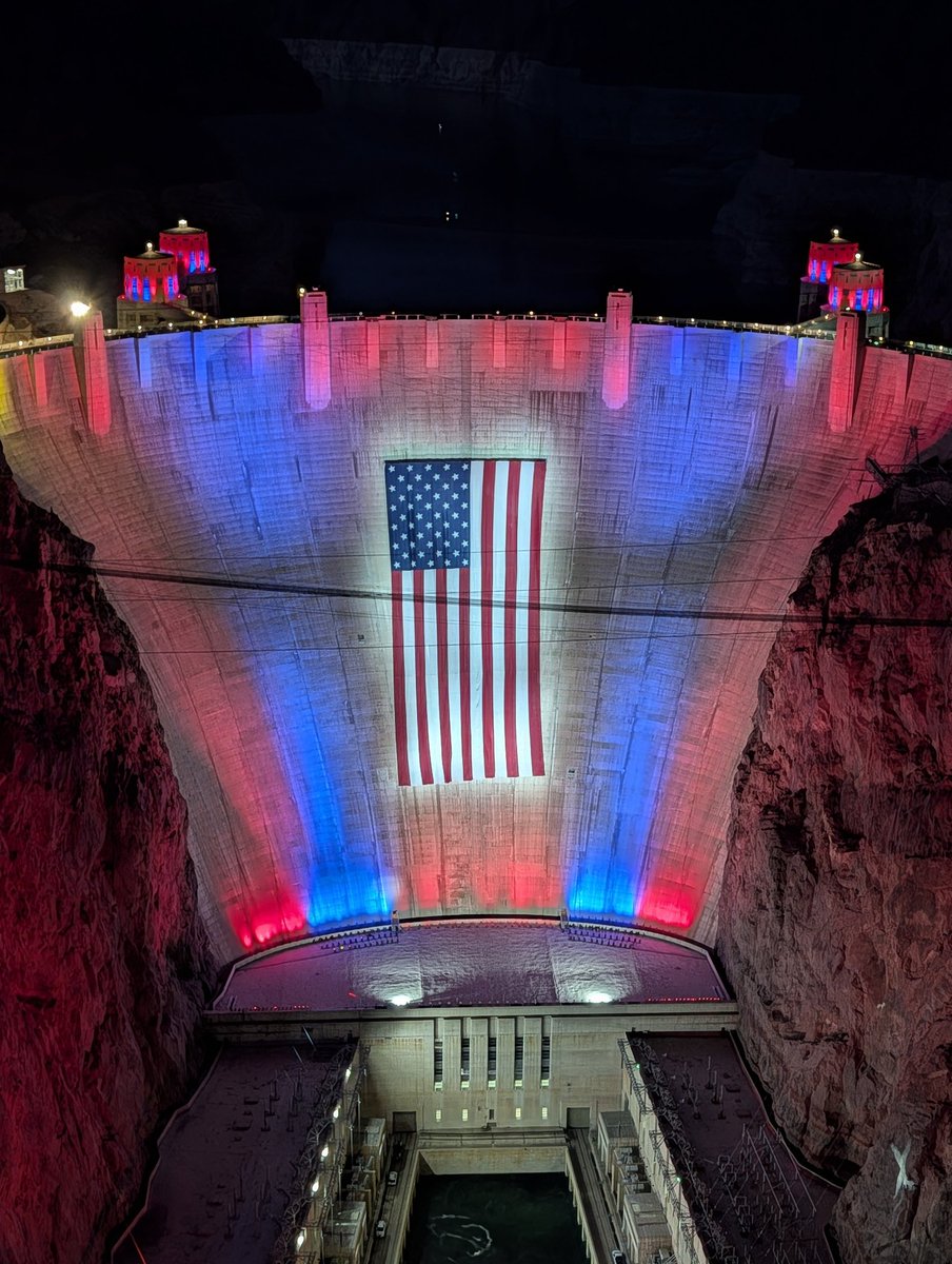 LasVegasLocally's tweet photo. Hoover Dam is once again going full red-white-and-blue every night through July 4.

The giant American flag will be raised overnight and visible to visitors starting Tuesday morning.

The top-of-dam and Memorial Bridge walkways will stay open until 10 p.m. each night. https://t.co/BSxyuBY1We