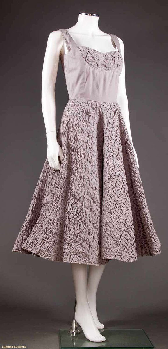 kateStrasdin's tweet photo. This is described as a summer party ensemble &amp; though it is a subtle shade, I love its mutedness &amp; attention to detail. The matching jacket is a neat piece of tailoring &amp; the skirt &amp; neckline are essentially a great swathe of smocking. Ceil Chapman, mid 1950s @AugustaAuction https://t.co/ajmI4TFvIj