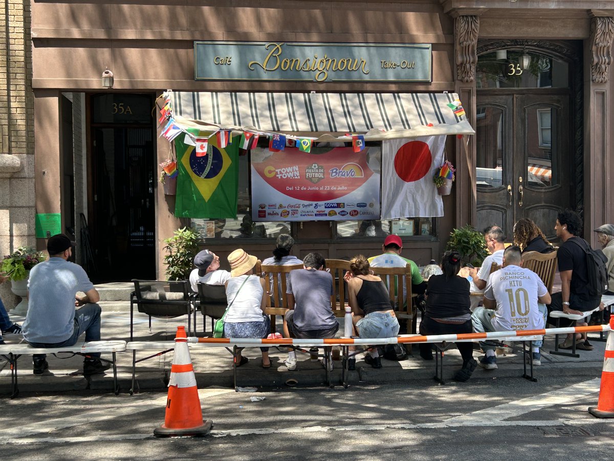 StacyHorn's tweet photo. A World Cup viewing on Jane Street, in the West Village, NYC. The takeout at this cafe, Bonsignour, is phenomenal. I highly recommend stopping by during lunch and getting something from inside to eat while you watch and socialize with my neighbors. https://t.co/Q4P1NYJwKv