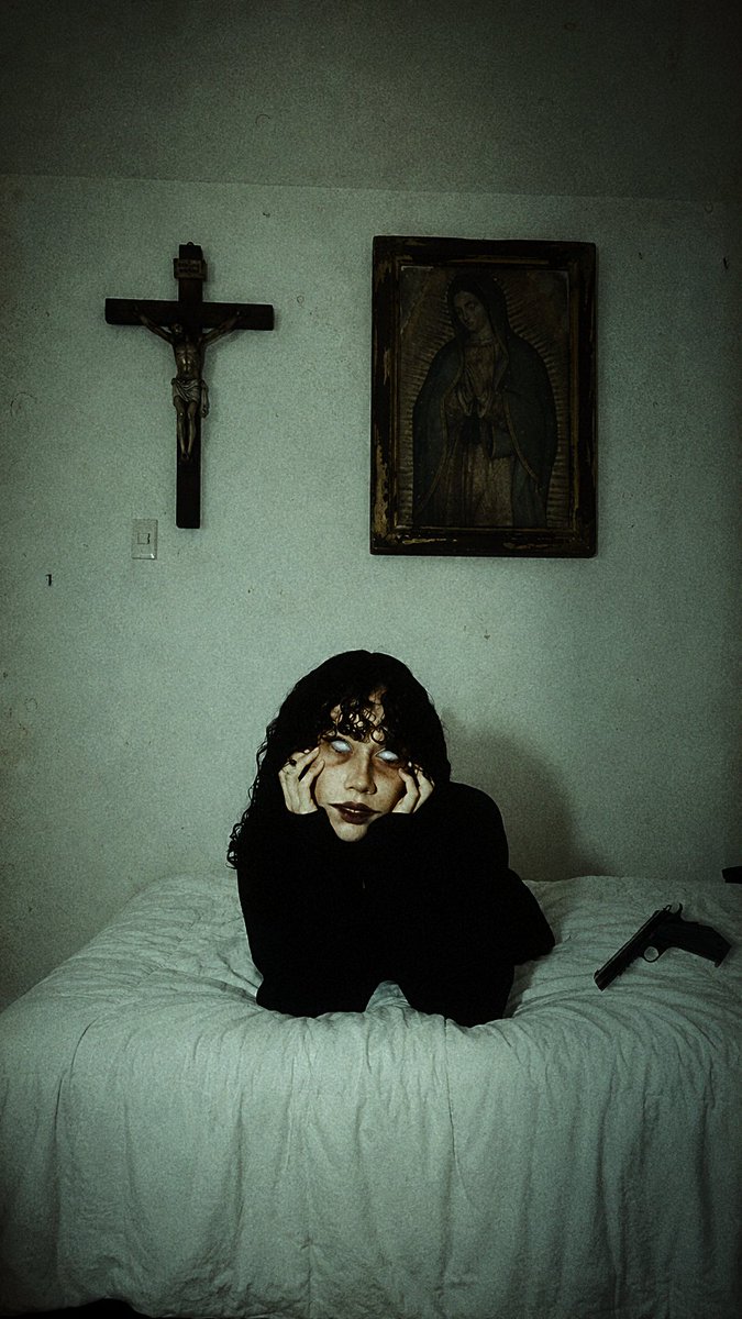 Lizethhorror's tweet photo. My mother hung a crucifix above my bed to protect me.
Every night I prayed beneath the Virgin's gaze.
Every night, something answered.
The prayers never drove it away.
They made it stronger. https://t.co/YyS3rWSmc0