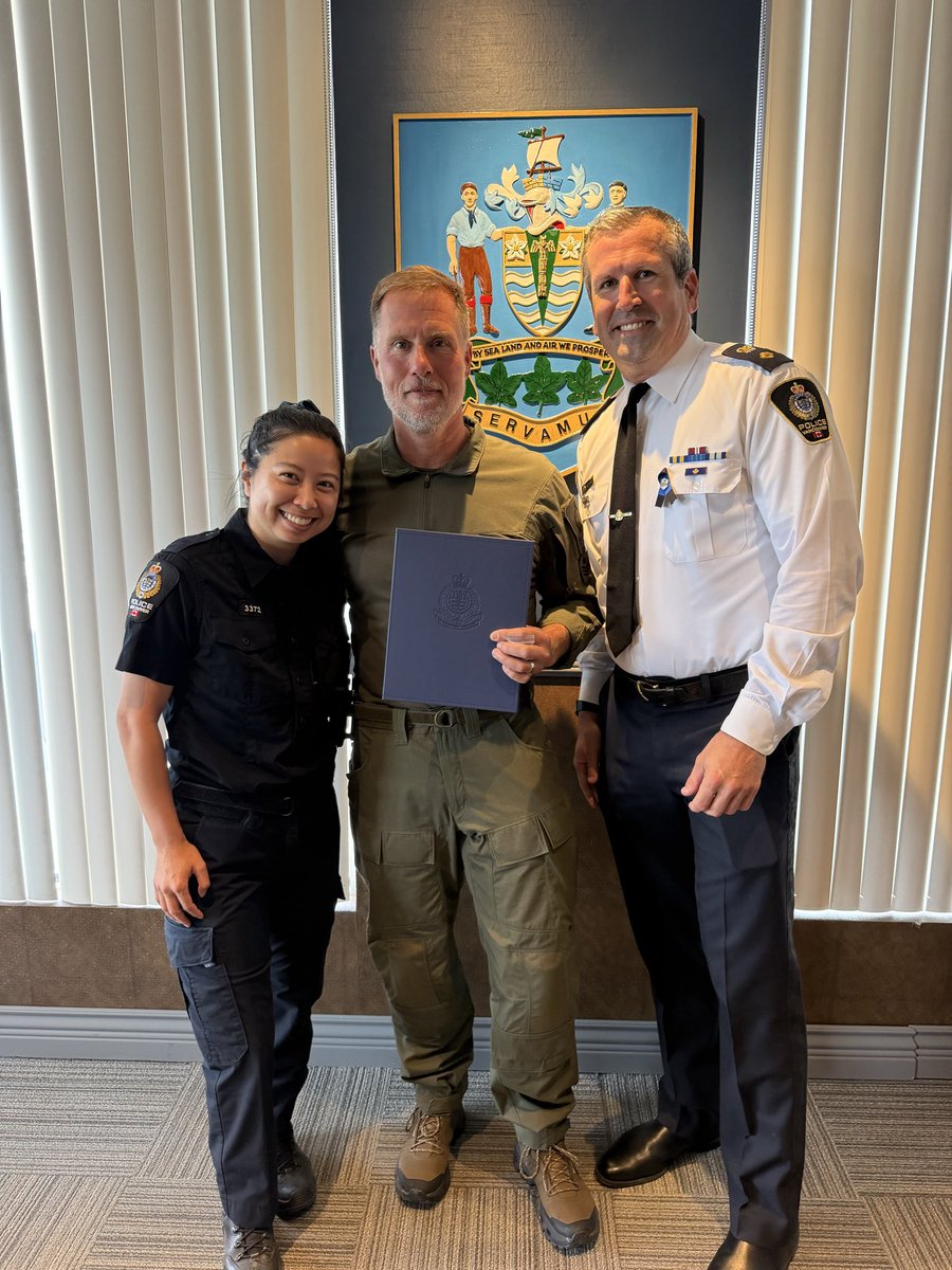 DeputyLaurin's tweet photo. Congratulations to Staff Sergeant Darin McDougall of the Emergency Response Section on receiving a Superintendent’s Commendation for demonstrating exemplary professionalism in arresting an alleged carjacker.  Staff Sergeant McDougall was off-duty when he witnessed one man punching a driver in what he thought might be a “road rage” situation.  While calling 911, he followed the driver to check on his well-being, but the vehicle quickly sped off out of sight.  Within moments, Staff Sergeant McDougall came across the vehicle on its roof after a rollover crash which shut down a major intersection.  He learned that the driver had stolen the vehicle and saw him trying to flee the scene.  He stepped in and helped arrest the suspect along with a responding #VPD sergeant.  Thankfully, no one was seriously injured.  #VPD #ServiceBeforeSelf #PublicSafety