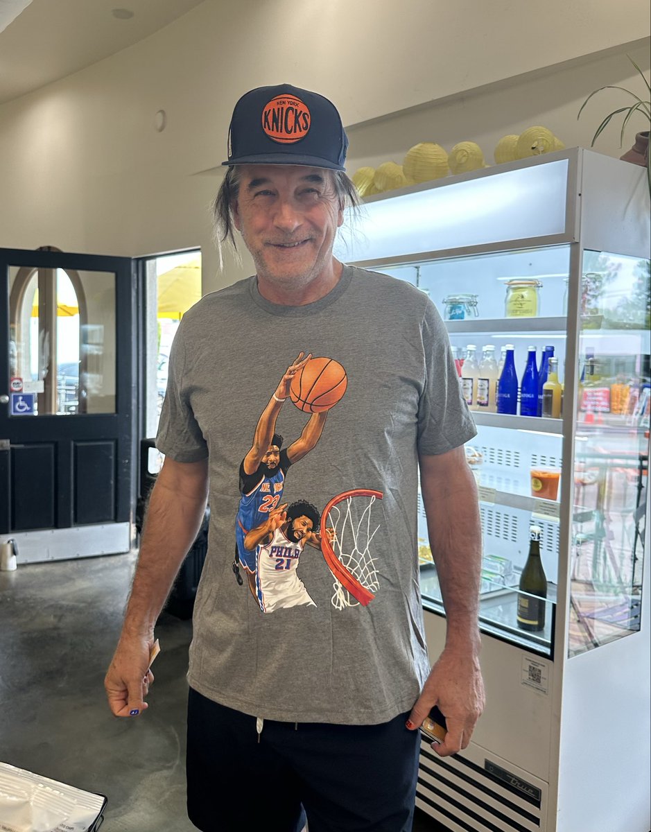 BillyBaldwin's tweet photo. Thoroughly enjoying my Knicks Championship Summer Celebration Tour 2026!!!!l 🏀🗽🏆🔥

This bad boy t-shirt of Mitch Robinson posterizing Joel Embiid arrived in the mail today!!

Thinking about an OG tip in tattoo next.
Thoughts... ??? 🤣 https://t.co/EpHhl0psI3