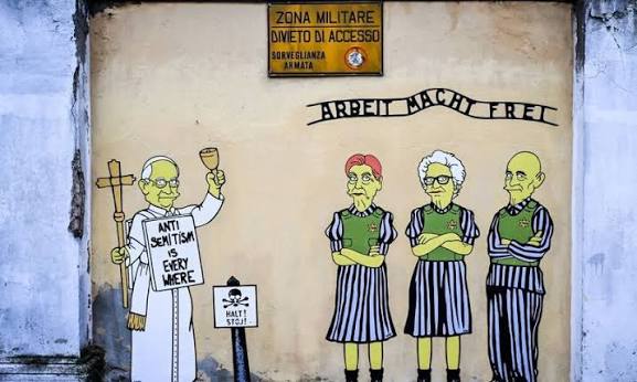 puzzledlili's tweet photo. @GL0SSMYLARG0 Jaja esos los hace un italiano sionista que hace murales pro-israel y mete a los simpsons en temas políticos. Es como Nik pero tano (?) https://t.co/5Br9uDacmn