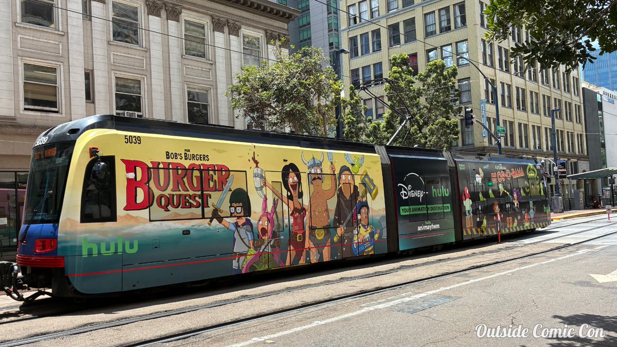 OutsideComicCon's tweet photo. The #SDCC trolleys are getting longer! A few more today from @gamestop @audible_com @hulu and @Crunchyroll : https://t.co/Ac4HCP6ocG