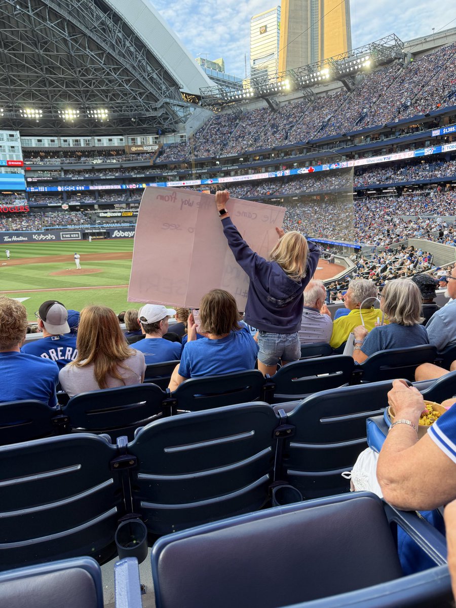 FloraM's tweet photo. Hey @bluejays - make sure you catch this little girl on your screen. Her sign says she came all the way from Australia for a #springerdinger #georgespringer  . She is in section 127 and we are all rooting for her! https://t.co/mW7tRhlt8G