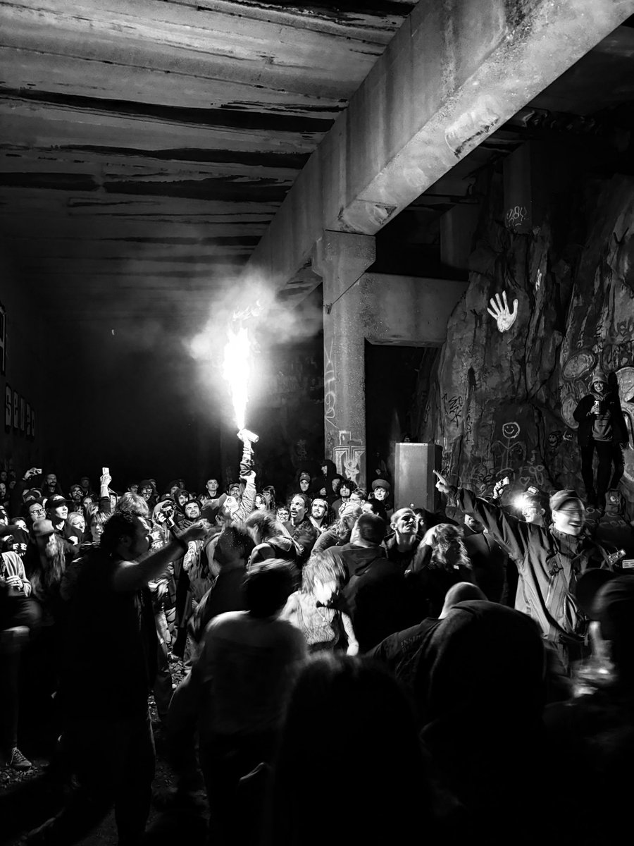 BobbyTheEmo's tweet photo. Hopping back on twitter for just a sec to share that my awesome local scene threw a generator show in an abandoned train tunnel in the mountains and it was completely insane. Here’s a pic I took paired with a pic someone took of me roughhousing with my friends :) https://t.co/vRyMHcMUv3
