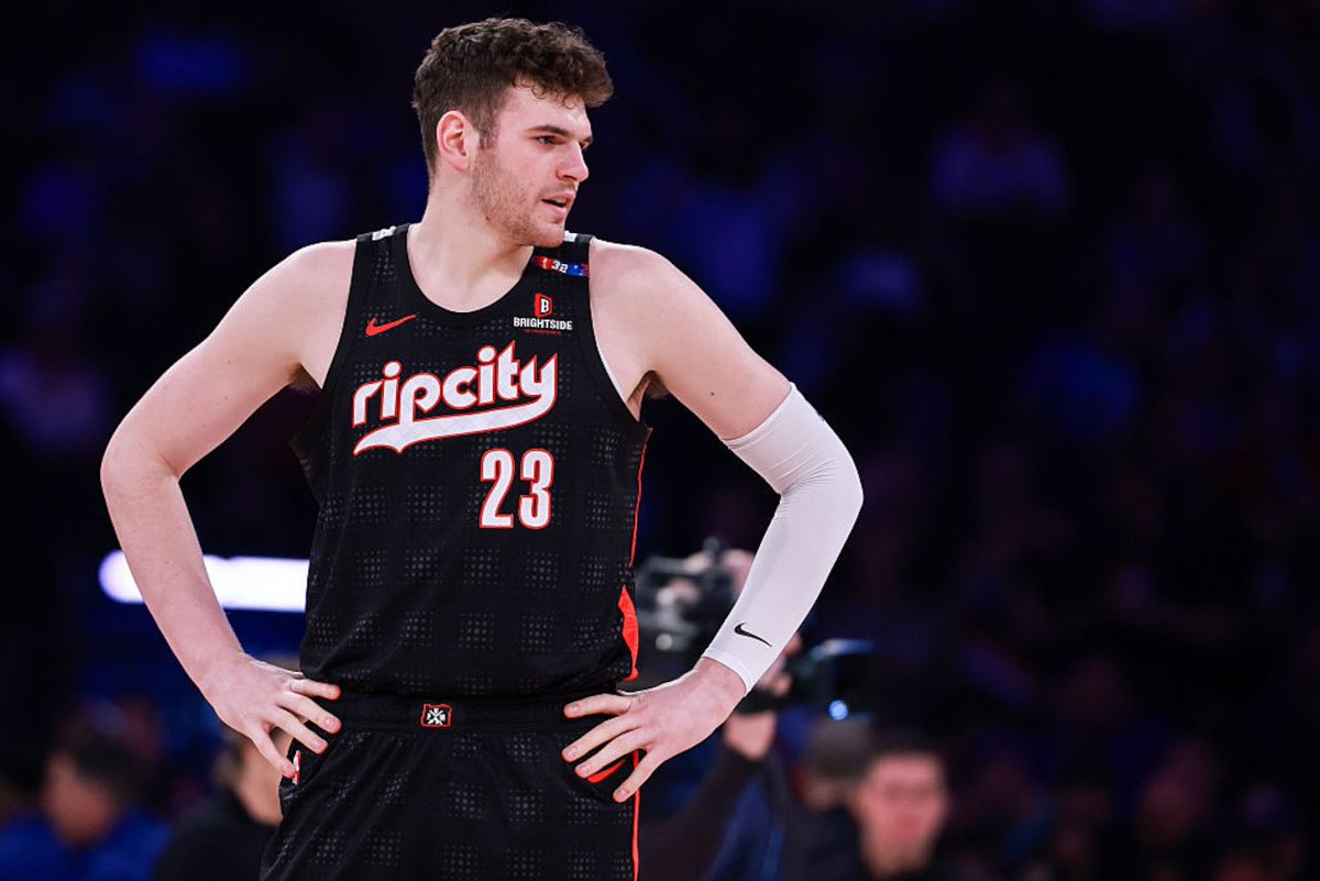 RTNBA's tweet photo. After landing Ja Morant, the Trail Blazers now consider Donovan Clingan all but untouchable, per @TheAthletic.

With two undersized guards in Morant and Damian Lillard, the 7 foot 2 Clingan's rim protection becomes essential to making the backcourt work 👀 https://t.co/60p5muXtku