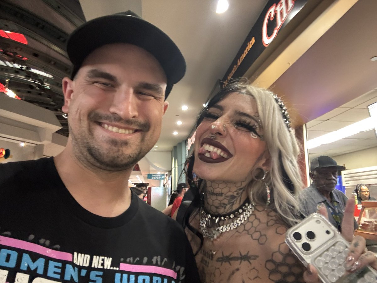 ChachGPT's tweet photo. Ran into the one and only @cruellamorgan tonight! Thank you for making my night and thank you for signing my @RheaRipley_WWE shirt! It really makes the shirt pop and thank you for the tag inscription too! 

Much Love: 
Chach 🖤 https://t.co/tUtvUSki9K