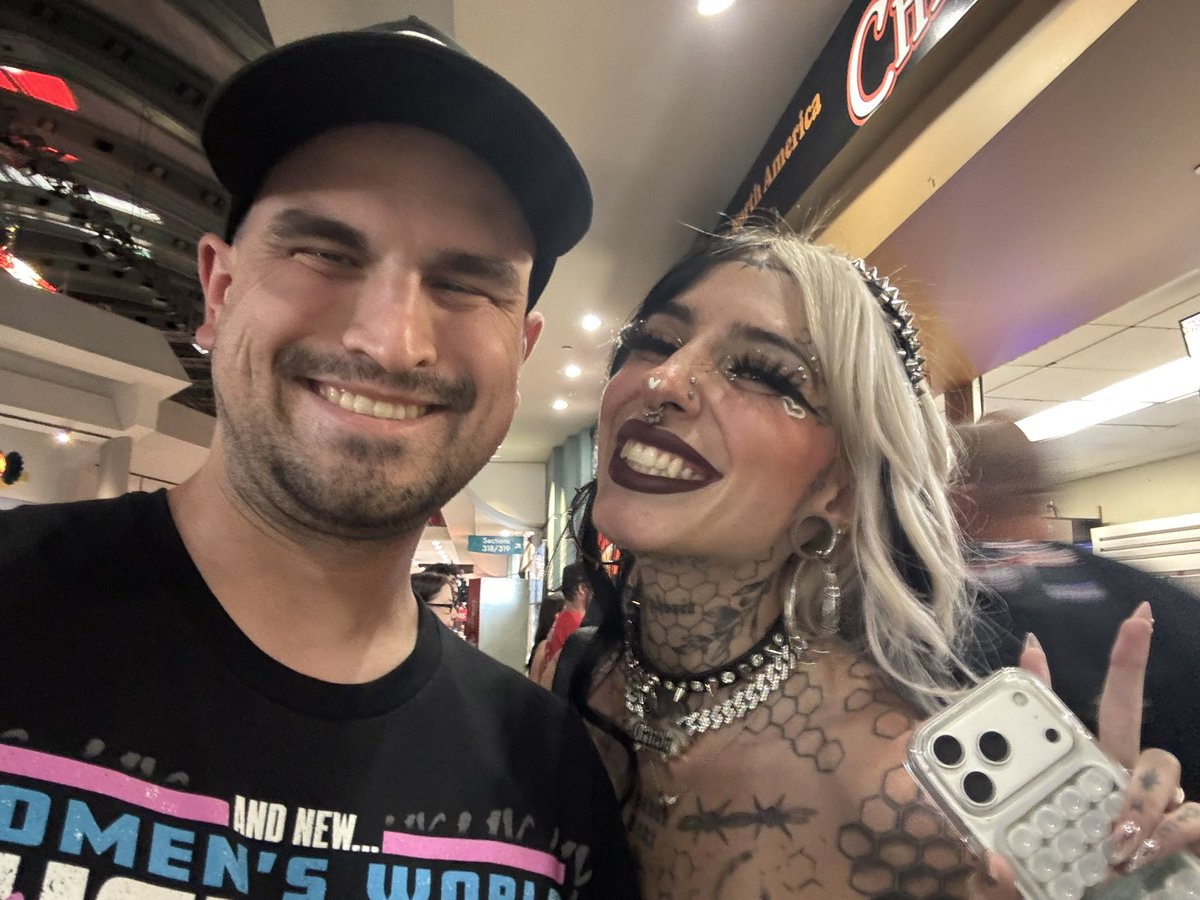 ChachGPT's tweet photo. Ran into the one and only @cruellamorgan tonight! Thank you for making my night and thank you for signing my @RheaRipley_WWE shirt! It really makes the shirt pop and thank you for the tag inscription too! 

Much Love: 
Chach 🖤 https://t.co/tUtvUSki9K
