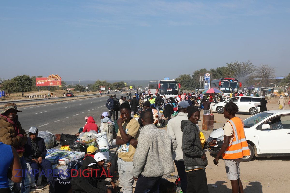HeraldZimbabwe's tweet photo. Some Zimbabweans who were based in South Africa are finding their own way home. Here, they are seen waiting for transport in Beitbridge this morning. However, most buses are taking advantage of the situation and have increased fares. 
📸 : Edward Zvemisha https://t.co/wgHZzAEx9Q