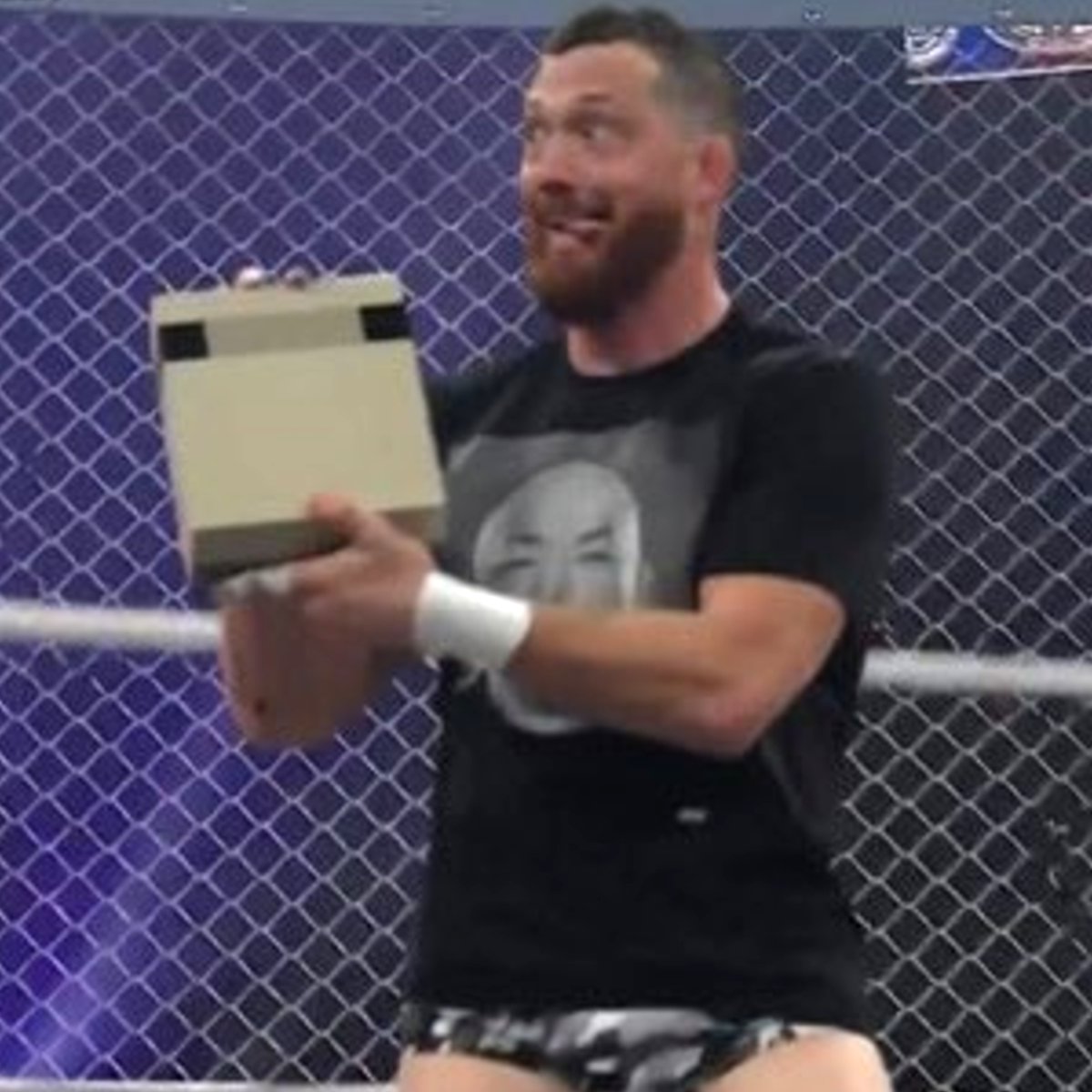 Dexerto's tweet photo. Wrestler Kyle O'Reilly pulled an NES out during an AEW cage match and used the console, controllers, and even a game cartridge as weapons

He blew into the cartridge before smashing it over his opponent's head https://t.co/Y49kMDVS5U