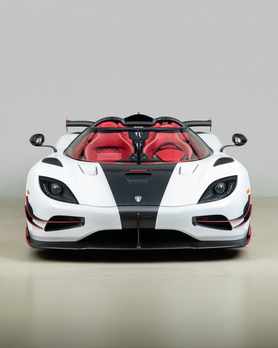 duPontREGISTRY's tweet photo. 2018 Koenigsegg Agera RS | Now available.

This example is chassis #24 of just 25 examples produced for worldwide distribution, representing the pinnacle of Koenigsegg's pursuit of speed. Finished in Arctic White over a striking red leather interior, it carries nearly $485,000 in factory options, including the coveted $245,500 Megawatt power upgrade.

Its twin-turbocharged 5.0-liter V8 produces an astonishing 1,341 horsepower, driving the rear wheels through a 7-speed dual-clutch transmission. Equipped with the One:1 aerodynamic package, carbon fiber monocoque, and hollow-spoke carbon fiber wheels, this is the very platform that cemented Koenigsegg's place in history by setting the production car top speed record of 277.87 mph in 2017.

For More Info: https://t.co/1g2EBXNuyz