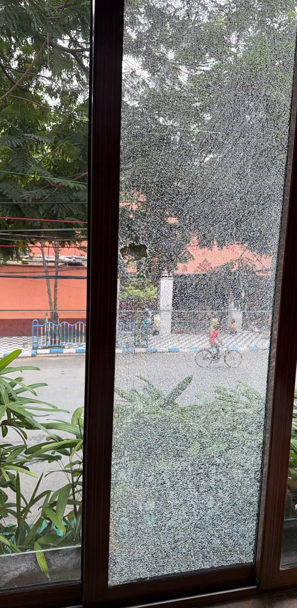 abhishekaitc's tweet photo. Bengal is witnessing the complete normalisation of violence under @BJP4India’s GOONDA RAJ.

In the early hours of this morning, an individual arrived outside my family’s residence, stopped his bike and repeatedly hurled a large stone at my home, shattering the first floor windows.

THIS IS NOT MERELY A COLLAPSE OF LAW AND ORDER. THIS IS THE DANGEROUS INSTITUTIONALISATION OF VIOLENCE.

Where was the police? Under whose instructions did this miscreant carry out such a brazen attack and walk away with complete impunity?

This is the terrifying reality of Bengal today: A regime that has normalised violence, empowered hooligans and created an atmosphere where those indulging in criminal acts operate with absolute confidence because they believe the State will protect them.

Will the newly passed West Bengal Public Safety and Control of Anti Social Activities Bill, 2026 be applied to BJP backed criminals as well?

Shocked, disturbed, and deeply concerned by what Bengal is being reduced to.