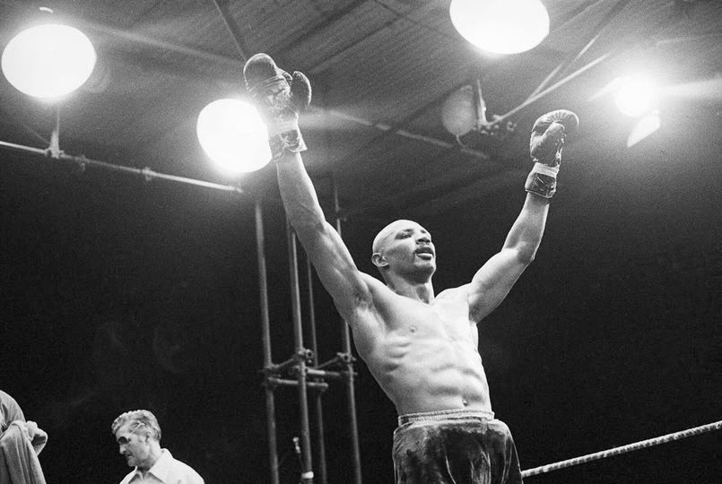 20thCentBoxIMM's tweet photo. Marvin Hagler raises his arms in triumph after scoring his 20th consecutive win, on June 30, 1979, after the corner of his opponent, Norberto Cabrera, threw in the towel during the 9th round in Monaco.

From the July 1st edition of The Tuscaloosa News:

Marvin Hagler stopped Norberto Rufino Cabrera of Argentina in the eighth round to earn a shot at the middleweight title.
Cabrera's handlers threw in the towel after the first minute of the eighth round of the scheduled 10-rounder after Hagler unloaded a barrage of heavy punches to the head. Hagler left the ring to cries of "world champ" from Americans in the tiny crowd of 1,000 in the temporary stadium erected in a parking lot in the Riviera resort city.
Hagler dominated every round as he walked and sometimes ran backwards, counter-punching all the way. The 5'11 American was adept at fighting at range and in close, and he closed the bout by coming forward and landing a lengthy series of power punches with nothing in return.
Cabrera scored in virtually every round with big hooks, but Hagler shrugged them off and landed five punches to each one of his Argentine opponent.
Hagler spent the week before the fight claiming himself world champion and asking, "Why don't they fight me?"

At this point, most are convinced that Hagler, fighting for the first time outside of the United States, is the best middleweight on the planet and he will soon get his chance to prove it as this fight is on the undercard of the Hugo Corro-Vito Antuefermo Middleweight Championship fight.
Antuefermo will win a 15-round split decision and he and Hagler will meet on November 30th in Las Vegas.