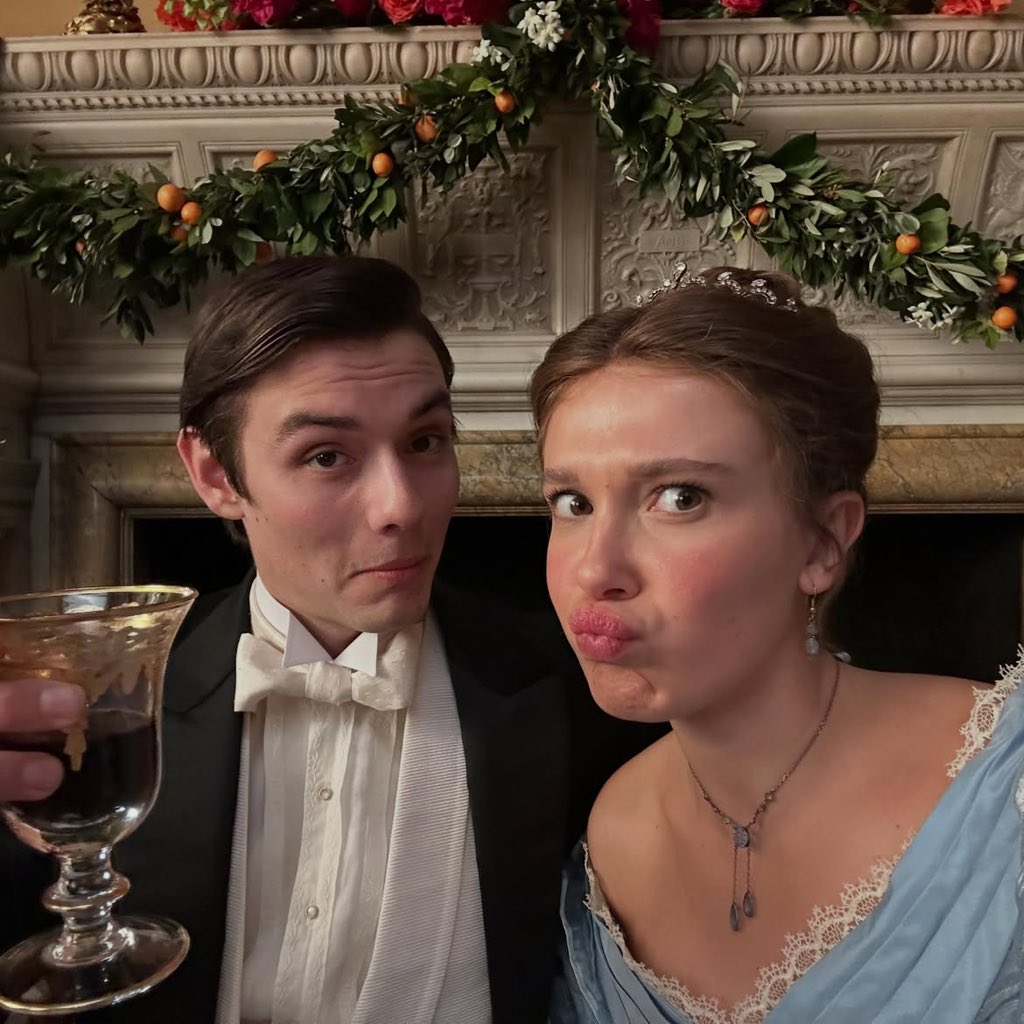 milliefeeds's tweet photo. millie bobby brown with louis partridge behind the scenes of enola holmes 3! 💐 https://t.co/TAZNKZbfPl