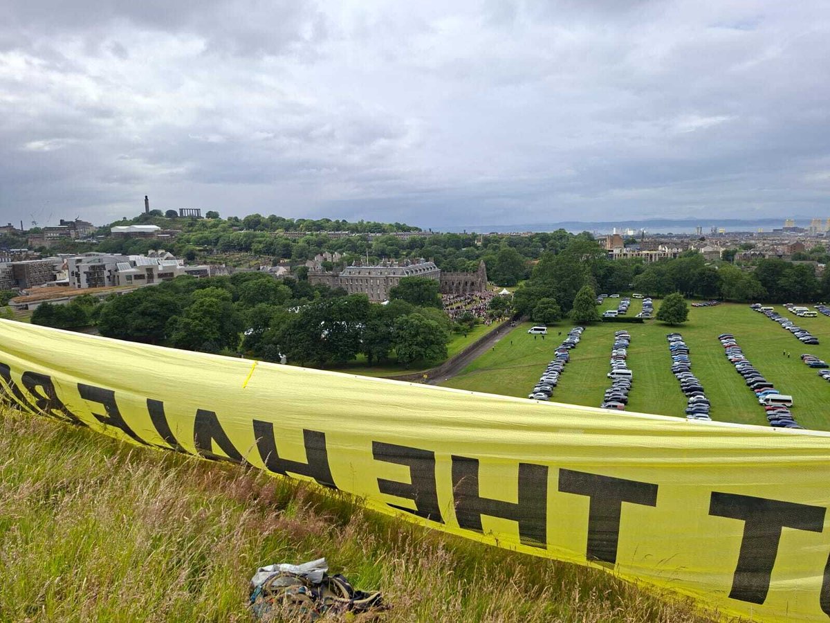 RepublicStaff's tweet photo. 👀 Activists have revealed a 'Cut the Half Billion Royal Budget' banner in view of the royals at the Holyroodhouse Royal Garden Party! It's time the government stopped bankrolling the royals. #AbolishTheMonarchy https://t.co/5xaGXWBIvP