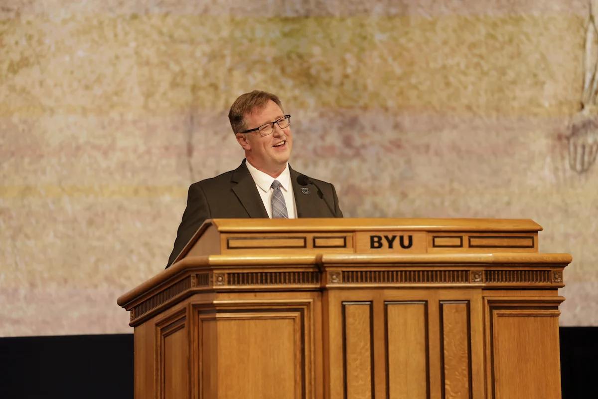 Anton E. Bowden speaks at a podium at BYU Devotional, June 2026