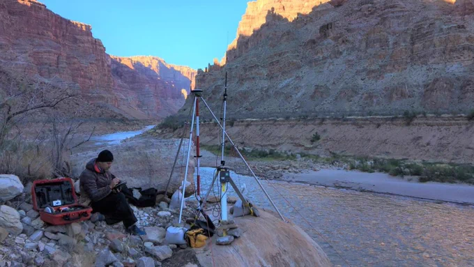 Setting up the RTK GPS base station above the Colorado River, downstream of the rapids of Cataract Canyon. Photo by Chris Wilkowske, USGS