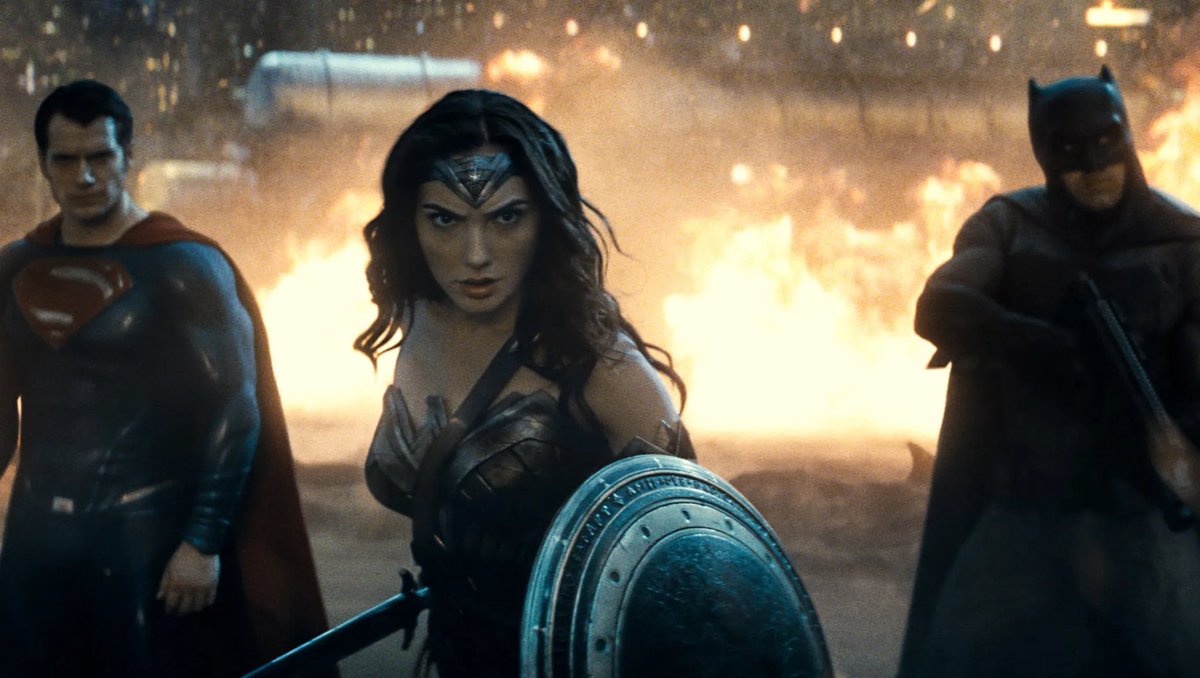 Signs2323's tweet photo. Zack Snyder had the stunning Gal Gadot as Wonder Woman front and center in the first ever on screen Trinity shot. To the biggest cheer and fan moment DC fans have had since it happened. 

Zack inspired millions of new fans of WW with this introduction. #RestoreTheSnyderVerse https://t.co/jh85YU58Bh