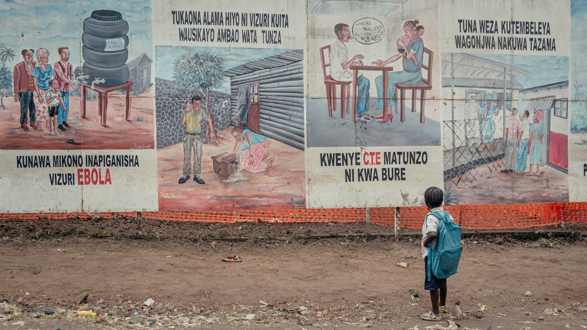 ADFmagazine's tweet photo. Experts urge closer community engagement and transparency for effective Ebola response.