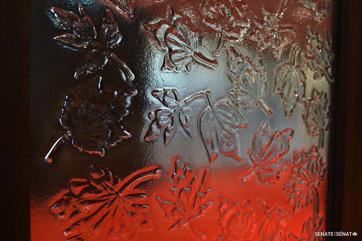 SenateCA's tweet photo. The maple leaf is Canada’s most cherished symbol.

The Red Chamber in the Senate of Canada Building is where senators representing Canada’s regions meet to debate legislation and issues of importance to Canadians. It is decorated with designs inspired by the leaves of all ten species of maple native to Canada.

These motifs appear in glass panels, are etched into wall panels and are woven into the Chamber’s carpet.

#SenCA