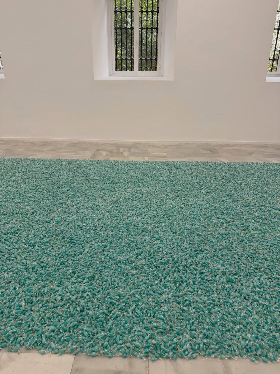 RMGlobalUnion's tweet photo. Namjoon shared “Untitled (Portrait of Ross in L.A.)” (1991) by Felix Gonzalez-Torres 💔

This installation consists of a pile of brightly wrapped candies poured into a gallery corner. The ideal weight of the pile is exactly 175 pounds, which matched his partner’s, Ross Laycock, healthy body weight. Visitors are encouraged to take a piece of candy. As the pile diminishes, it mirrors Ross’s weight loss and fading health. However, the artist stipulated that the gallery must replenish the candies daily, metaphorically granting his lover eternal life and rejuvenation.

#방탄소년단RM #RM