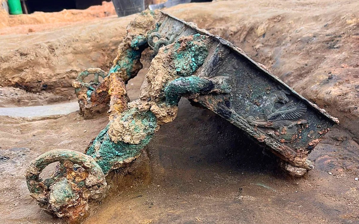 archaeologymag's tweet photo. Exciting Iron Age find in Spain! The wheels and parts of a miniature bronze chariot have been discovered at a Tartessian site near an altar shaped like a bull hide. The decorations on the frame include twisted rope, two griffins, and a Greek river god.

https://t.co/1IYwoZKPi1 https://t.co/TS0Gze2rxK