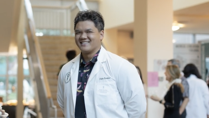 uhmanoa's tweet photo. Waiākea High grad Duke Escobar is now a physician after graduating from @uhmedjabsom. Driven by his Hawaiʻi Island roots, the first-gen college grad matched into a pediatrics residency and plans to return home to Hilo to serve his community ➡️ https://t.co/LJX8qfZnX3 https://t.co/UtnrdkmIa4