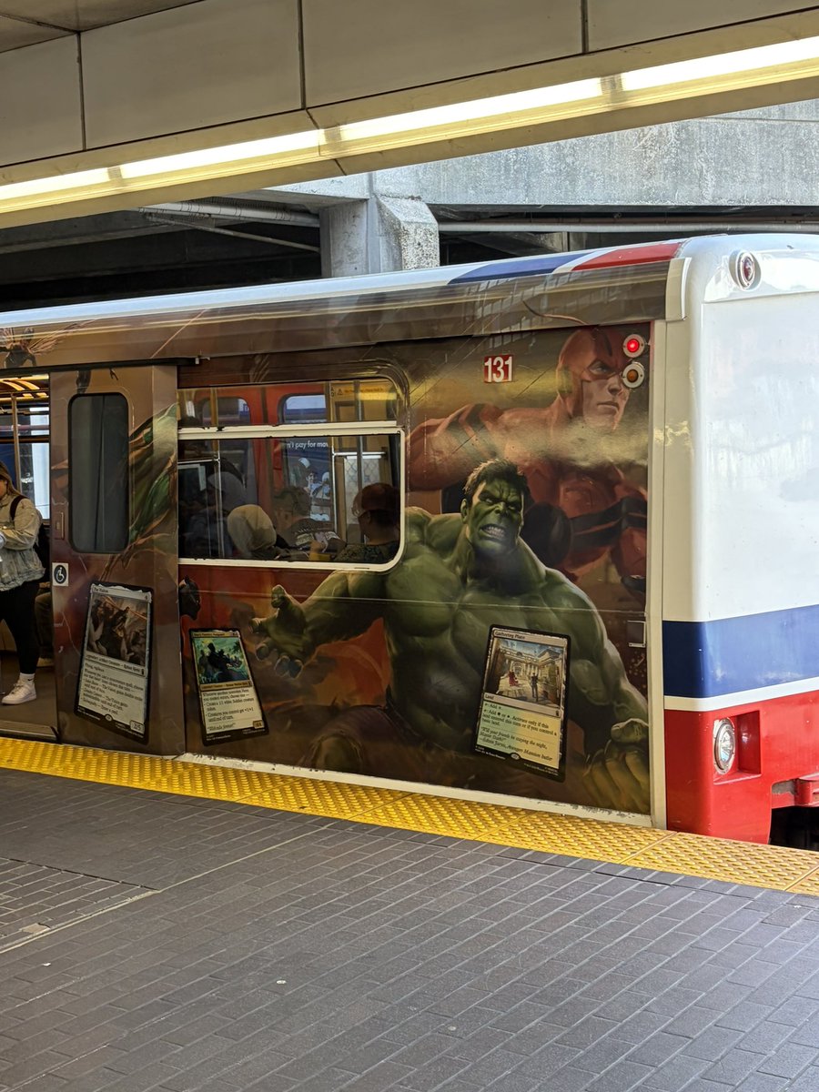 Liv_Agar's tweet photo. Imagine falling onto the tracks and getting flattened by the magic the gathering skytrain https://t.co/rty5Y2Wiag