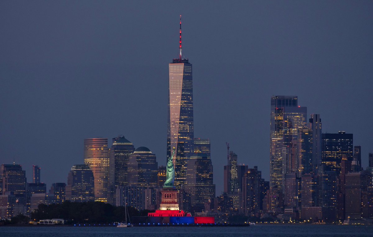 GaryHershorn's tweet photo. The Statue of Liberty lit for America250 and with a 99 percent illuminated waxing gibbous moon, Tuesday evening in New York City #newyorkcity #nyc #newyork #statueofliberty #moon https://t.co/SgOecJlLSx