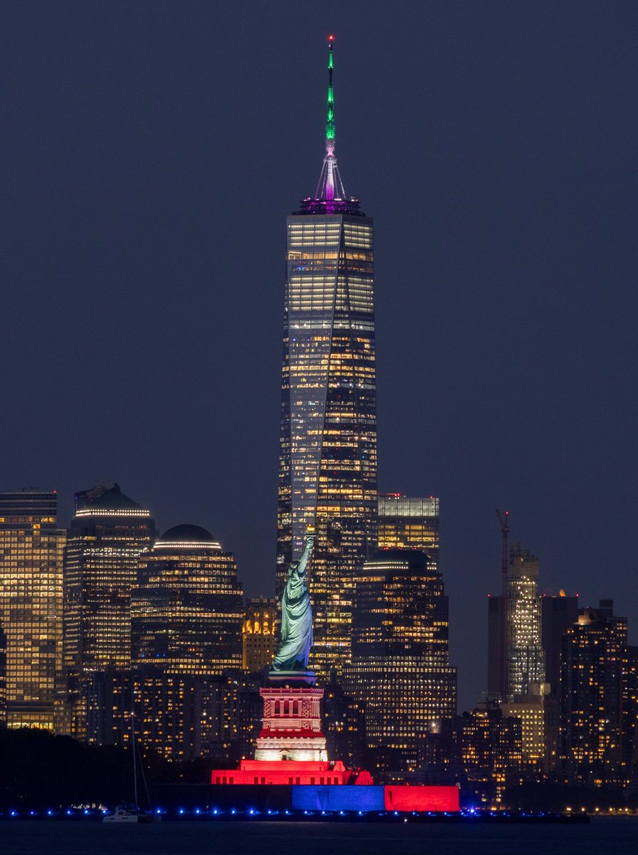 GaryHershorn's tweet photo. The Statue of Liberty lit for America250 and with a 99 percent illuminated waxing gibbous moon, Tuesday evening in New York City #newyorkcity #nyc #newyork #statueofliberty #moon https://t.co/SgOecJlLSx