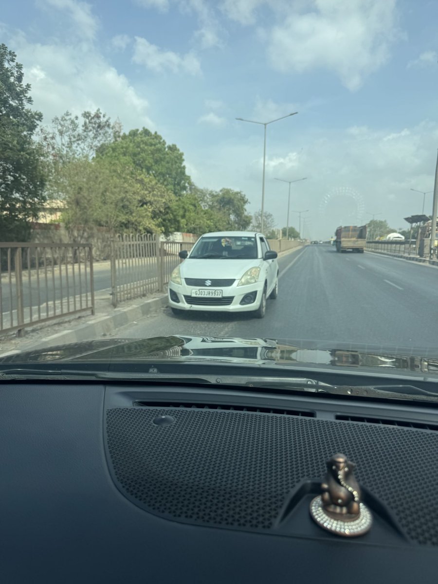 RajKachrola's tweet photo. 1/2 @GujaratPolice @dgpgujarat This car is driving fearlessly on the wrong side because it seems our Morbi Police is sleeping. We've posted photos and reported this many times, but no one seems to care about our lives or safety. Shame on Gujarat Police. #Morbi #RoadSafety https://t.co/gN7isY2wwm