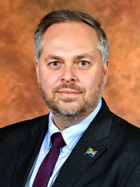 ZungulaVuyo's tweet photo. Important Reminder:

This is the face of the immigration crisis. He is the Minister of Home Affairs, which only has 832 immigration officers for over 3 million illegal foreigners. 

The immigration officers don’t even have document scanners, biometric devices, real-time database access. They intentionally broke down the capacity of the State to deal with immigration crisis.