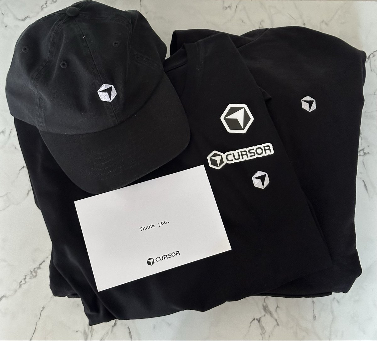 KdJadeja911's tweet photo. Thanks for the swag, Cursor team! Let’s build. 

Can’t wait to wear it.

Special thanks to @ftnabeelah and @sunrao https://t.co/B8lz3Dcvz1
