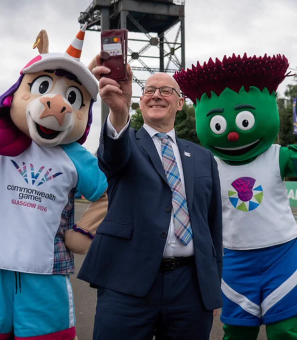 First Minister John Swinney taking a selfie with Commonwealth Games mascots Clyde (Glasgow 2014) and Finnie (Glasgow 2026).