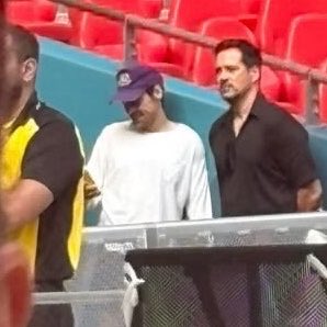 larrybeliever91's tweet photo. The giant screen showing the match, and there he is, messaging his husband about the match! You can tell just by looking at his face, haha https://t.co/x36RMAP36Z