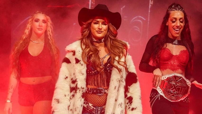 WrestleTalk_TV's tweet photo. Fallon Henley "almost said no" to the WWE opportunity that eventually got her signed in 2021 after the loss of the first of two of her sisters that passed away:

"Kind of crazy, kind of happened out of nowhere. I have twin sisters who are no longer with us. The first one passed during that year. That was right before I got the call to do the extra work that got me my third tryout match with Elektra (Lopez).

"It was a really hard time, like I said it kind of came out of nowhere. All her organs shut down, she got rushed to the hospital and before we knew it she was gone.

"She left behind her two daughters that were still living with her and her son. They had lost their dad, I wanna say a year or two before then, so they have had a very, very hard beginning of life. But I was over in Tampa, and that’s where they had been living at the time and the only options they really had were to go to Michigan to be with my mom, go to California to be with one of my other sisters or come and stay with me.

"I had a two bedroom apartment at the time, I brought them in. They shared one of the rooms, I took the smaller one. I think they were like 16 and 17, so, one still had to finish high school and the other one was just starting college.

"So kind of a big change for, what was I at the time? 22 or something. Taking in these two teenage girls who for my sake were extremely well behaved and mature given the life they had gone through and the hardships they had gone through.

"So when I got that call to do the extra work, I mentally was not in a place where I thought I could do it. And I almost said no, and had I said no, I wouldn’t be here right now, I wouldn’t be on SmackDown doing any of the things that I’m doing.

"And I feel like that was a little part of my sister kicking me and telling me to go do it, because she knew how much I wanted this and she was probably, Heather and Heidi were the twins and they were probably my biggest supporters ever. So a lot of what I’m working for now is for them."

(What Do You Wanna Talk About? with Cody Rhodes)