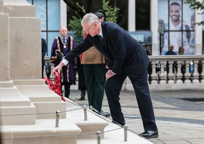Secretary of State Hilary Benn laying a wreath at Belfast City Hall