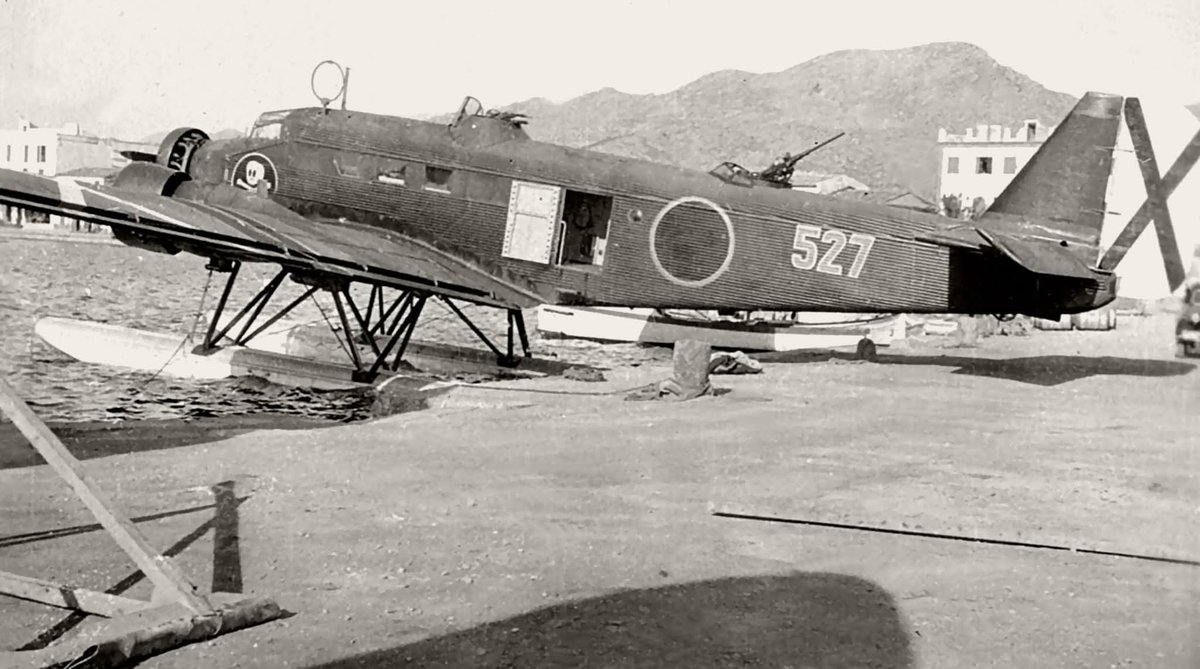 Postmanden1's tweet photo. Junkers Ju52/3mg3e(W) ' red 527' of Legion Condor AS/88  at Port de Pollensa, Mallorca , Balearic Islands, Spain, march 1938. The one and only received in Spain. Notice totenkopf(skull) emblem. https://t.co/fFBRx9VLqX