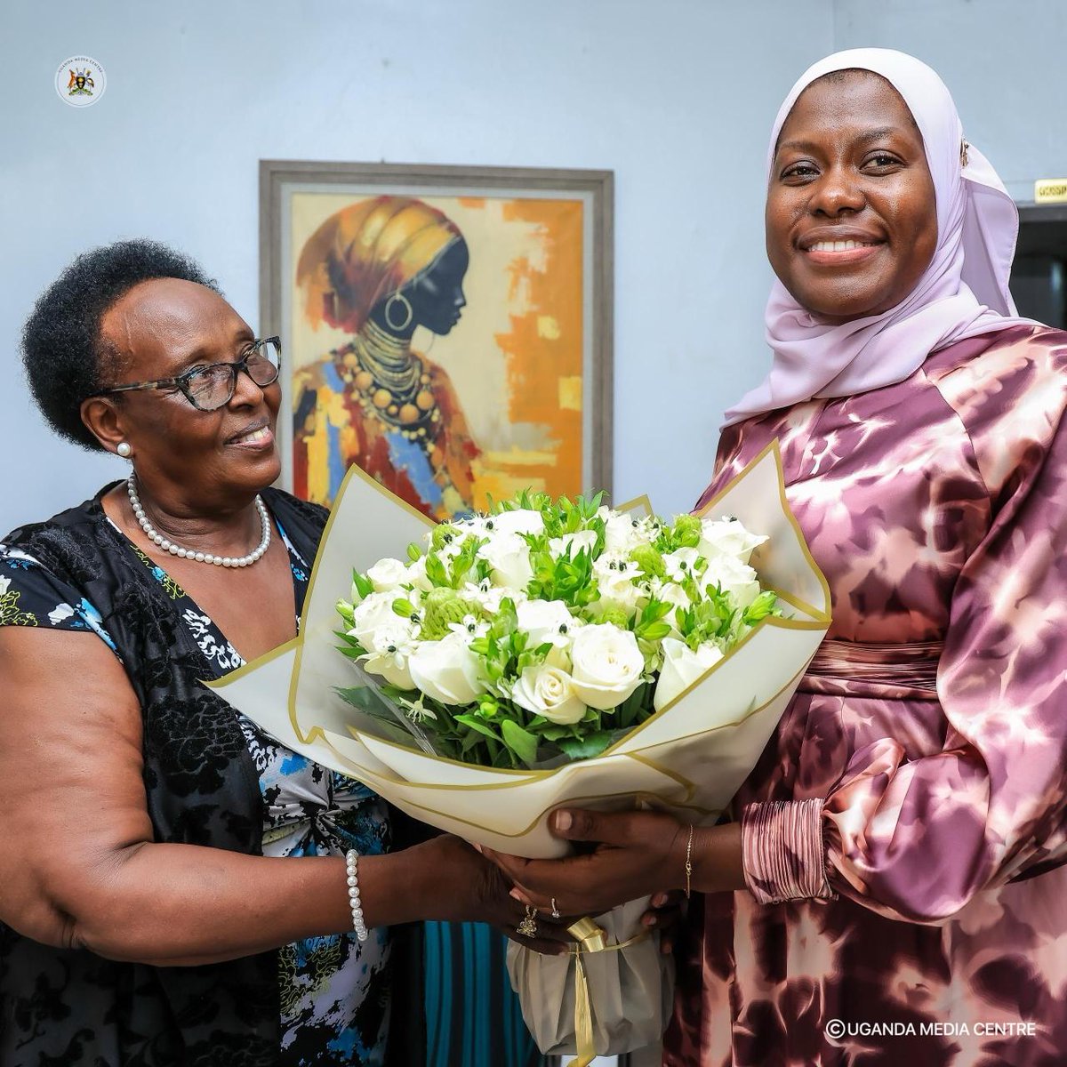 UgandaMediaCent's tweet photo. The Permanent Secretary @MoICT_Ug, Ms. @azawedde, received a bouquet of flowers from Mrs. Rosette Batanda, the 'Maaama' of the Uganda Media Centre, in recognition of her steadfast leadership. https://t.co/bdSwIMrT8c