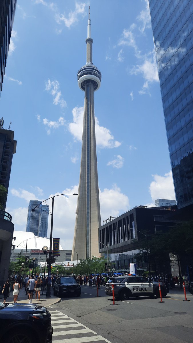 PortuGoal1's tweet photo. Big crowd congregating near the CN Tower, Toronto, not to take tourist pics but to catch a glimpse of the Portugal team and you know who. Seleção rumoured to be staying in the nearby Delta hotel https://t.co/9Wtpih2hg9