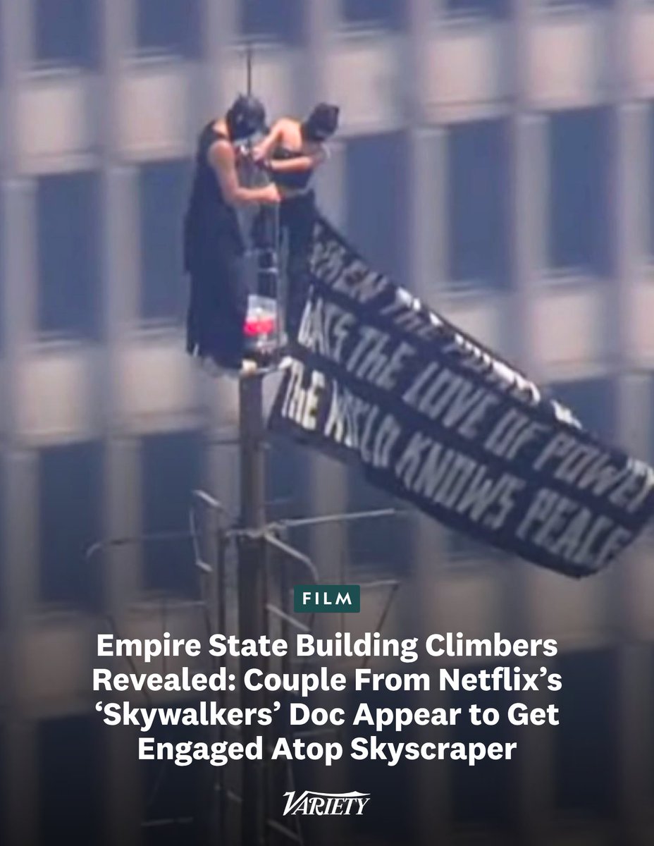 Variety's tweet photo. The couple from the 2024 Netflix doc “Skywalkers: A Love Story” illegally scaled the Empire State Building on Wednesday:

• Ivan “Vanya” Beerkus and Angela Nikolau were on top of the building for about half an hour, waving a giant flag that read: “When the power of love beats the love of power, the world knows peace” 

• The couple also appeared to get engaged, as Beerkus got on one knee and placed a ring on Nikolau’s finger

https://t.co/365qz9hY35