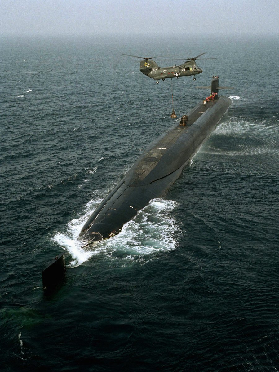 RealAirPower1's tweet photo. As the U.S. Navy officially retires the blue-collar C-2 Greyhound, I’m reminded of the time we said goodbye to another absolute legend of fleet logistics: the CH-46 Sea Knight. Here’s a throwback shot from 1991 of a Sea Knight dropping off goodies to the USS Ohio (SSBN-726). The good ol' days.