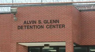 JungleBall_2's tweet photo. Columbia, South Carolina,💥JAIL OUT OF CONTROL💥James Lipscomb (arrested), 66yr. old Director of Compliance and Safety at Alvin S. Glenn Detention Center, was arrested for obstruction of justice because he allegedly ordered staff to cover up dead inmate Keith Bagley’s April 7, 2026 overdose death from synthetic cannabinoids (K2/Spice). 
Director Lipscomb told them NOT to notify the sheriff’s office or coroner, letting a crime scene get destroyed and evidence disappear. That’s not compliance, that’s criminal protection of the rot inside his own jail.
And he’s not alone. This sweeping investigation into 62+ unreported crimes (drugs, assaults, and worse) dating back to December 2025 has now produced charges against over two dozen people connected to the facility.
The seven detention officers arrested include:
➡️Jasmine Outing, 23 - misconduct in office (caught in a closed office with a male inmate)
➡️Diamond Jackson, 36 - misconduct in office and sexual misconduct (contraband involved)
➡️Sakinah Adams, 24 - contraband in the jail
➡️Ashley S. Smith, 27 - contraband in the jail
➡️Joydan Foust, 25 - misconduct in office (using narcotics on shift and taking multiple payments from inmates)
➡️Paul Medlock, 30 - third-degree assault and misconduct in office (excessive force, hid his involvement)
➡️Michael Simmons, 24 - second-degree sexual misconduct with an inmate and third-degree criminal sexual conduct (assaulted an inmate; victim reported it to jail staff but it was buried for 12 days)

Seventeen inmates are now facing new charges, many for assaulting staff (at least 10 since mid-April alone):
Javonte Scott (20)
Michael Hughley (28)
Javeria Sloan (20)
Trevor Harris (21)
Toni Wilson (52)
Robert S. Smith (26)
Deandre Crosby (20)
Mystikal Murray (25)
Trenton Morris (23)
Daquan McCoy (30)
Tia Murrell (29)
John M. Montgomery (32)
Malik Parker (24)
Waddell McGhee (19)
Jerimiah Cole (20)
Carson Martin (34)
Montair Booker (41)
Columbia, South Carolina Sheriff Leon Lott is finally holding some of these people accountable after “good, honest” staff inside the jail helped expose the mess. 
But Richland County officials who actually run this nightmare have blood on their hands too, they ignored DOJ warnings, ignored prior deaths and settlements, and let a culture of cover-ups and contraband thrive for years. 
Keith Bagley is dead because of this deliberate obstruction and systemic failure. 
No more excuses, no more wrist-slaps, no more “we’re working on it.” 
Prosecute James Lipscomb, Jasmine Outing, Diamond Jackson, Sakinah Adams, Ashley S. Smith, Joydan Foust, Paul Medlock, Michael Simmons, and every single enabler to the fullest extent of the law. 
Fire the rest. Tear this broken system down and start over. 
Enough dead inmates. Enough buried crimes. Enough corruption wearing a badge or a uniform.